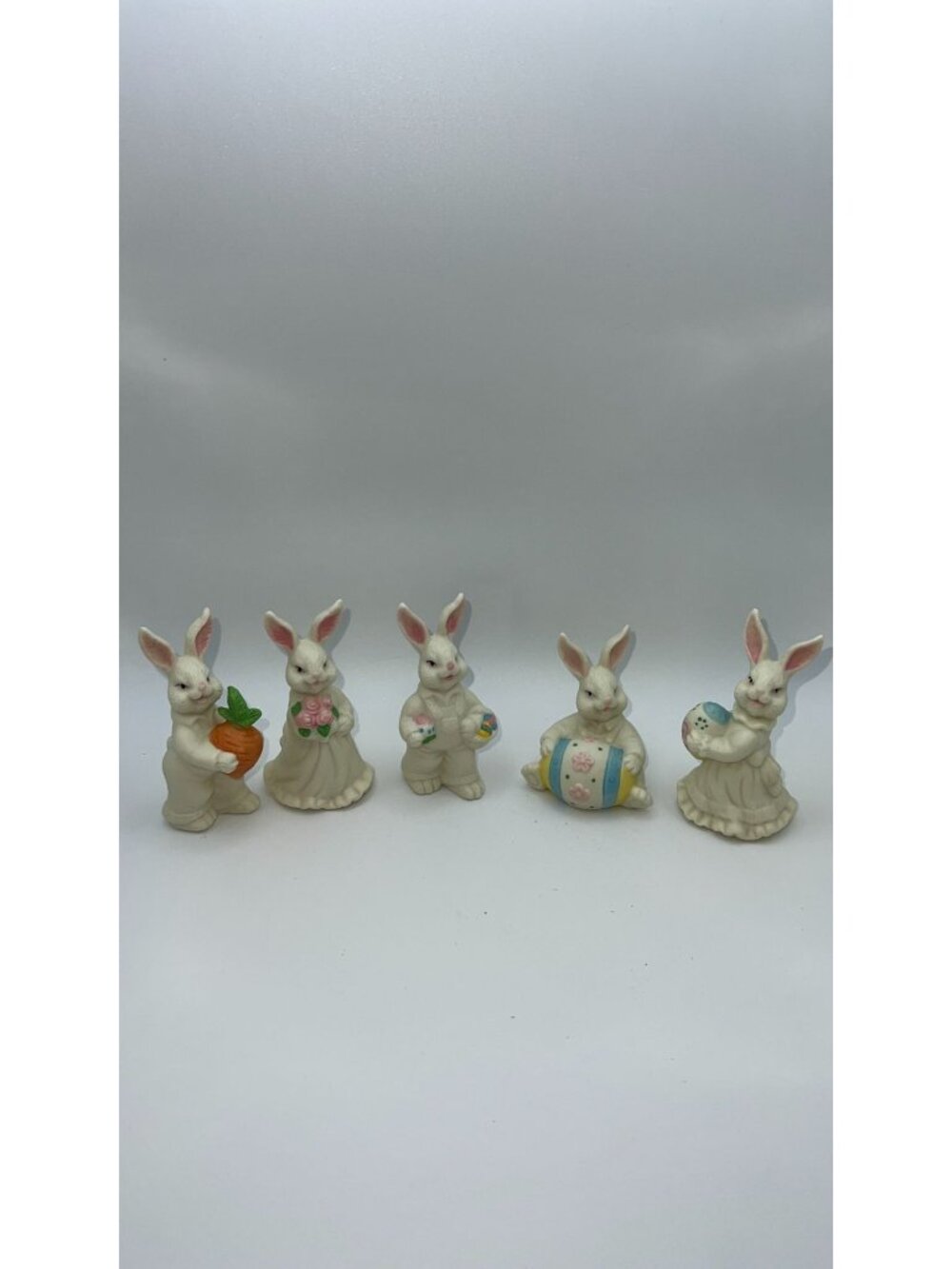 Set Of 5 Porcelain Bunny Figurines Holding Flowers Carrots & Easter Eggs
